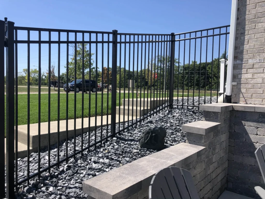 Ornamental black aluminum security fence providing an elegant and zero-maintenance boundary for a North Dakota home.
